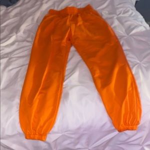 neon orange sweatpants